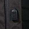A close-up of a feature on a black backpack, showcasing a zipper pull and textured fabric.