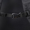 A close-up of a black adjustable buckle on a mesh-backed backpack. The texture is visible.
