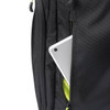 A silver tablet peeks out from the side pocket of a black Swissdigital Java Backpack.
