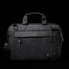 A black laptop sleeve with a zippered front pocket, handle, and a keychain accessory. It features a logo.
