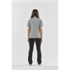 A woman stands with her back to the camera, wearing a grey Women's Volante H2X-Dry Tee and black pants.