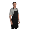 A black chef's apron on a model, featuring a neck strap and front pocket. The model wears a grey t-shirt underneath.