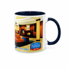 A two-tone coffee mug in blue and white with a logo, featuring an interior design image.