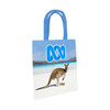 A tote bag featuring a kangaroo on a beach background, with blue handles and a logo.