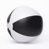 A beach ball with black and white segments, featuring a smooth, inflatable surface and a circular design.