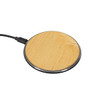 A bamboo wireless charger with a natural wood finish and a black border, featuring a connecting cable.