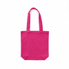 A pink canvas tote bag with two handles and a rectangular base, featuring branding on one side.