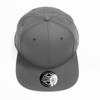 A grey cap with a structured design, featuring a logo on the front. It has a curved brim and six panels.