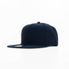 A navy cap with a flat brim and a logo on the front. The cap has a structured design.