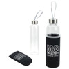 A drink bottle featuring a clear glass body and a black neoprene sleeve, with a stainless steel lid and a logo.