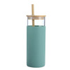 A drink bottle in a soft green shade with a glass body and a bamboo lid featuring a straw.