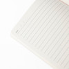 An open A5 thin PU cover notebook featuring lined pages and a section for the date, with a clean, minimalist design.