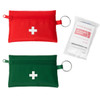 Two small first aid kits in red and green, each with a white cross, accompanied by a package of anti-mosquito towelettes.