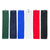 A collection of cotton golf towels in green, navy, blue, white, red, and black, each with a loop for hanging.