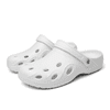 A pair of white clog slides with multiple ventilation holes and a side logo.