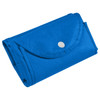 A foldable non-woven shopping bag in bright blue, neatly folded and secured with a snap closure.