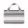A foldable beach towel bag in grey and white stripes, featuring sturdy handles and a fabric texture.