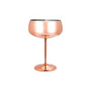 A stainless steel cocktail coupe in a polished copper finish, featuring a sleek stem and base, with an inner metallic surface.