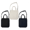 A set of three plain tote bags in black, cream, and navy, featuring handles and a logo on one.
