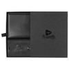 A black travel gift set featuring a wallet and luggage tag, presented in a sleek black box with a logo.