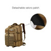 A tactical backpack in tan and brown featuring multiple compartments, straps, and a detachable velcro patch.