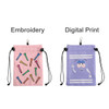 A pink pouch with colourful golf tees design and a purple pouch featuring a playful character, both with drawstring closures.