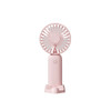 A pink handheld fan with a detachable base, featuring a button for operation and a sleek design.