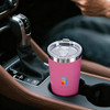 A drink bottle in a car’s centre console, featuring a pink stainless steel double wall design and a lid.