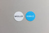 Two circular seed paper pieces, one white with "ROLLER" text and one blue featuring the "CLEANAWAY" logo.