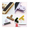 Plastic magnetic clips in various colours: beige, purple, brown, green, yellow, and white. Includes a logo on the clips.