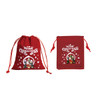 Red Christmas drawstring gift bags featuring festive designs with characters and snowflakes, with branding present.