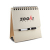 A white memo whiteboard notepad with a spiral binding and a black marker, featuring a logo on the front.
