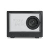 A black speaker with a prominent circular speaker and a transparent front, featuring branding and control buttons at the bottom.