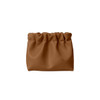 A portable makeup bag in a rich brown colour, featuring a gathered design and no zippers. It has a logo on it.