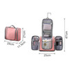 A pink travel bag with multiple compartments, featuring zippers and a hanging hook for easy access. It has a logo.