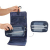 A navy blue folding travel toiletry bag with mesh zippered compartments and hooks for hanging. Features a logo.