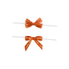 Two orange twist tie bows with text, featuring different styles of ribbon and a white twist tie.