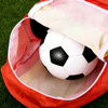 A red foldable gym bag with a white and black soccer ball inside. The bag has a logo.