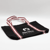 A black canvas tote bag with red and white striped handles and a logo.