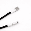 A black charging lanyard with white connectors at both ends, featuring a USB and a Lightning connector.