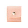 A pink mini synthetic leather jewellery bag with a snap closure and stitching detail. It features a small logo.
