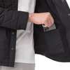 A black insulated shacket with a hand placing a phone into an interior pocket, featuring a logo.