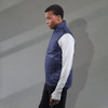 A men's lightweight packable insulated puffer vest in navy, featuring a zippered pocket and a logo.