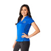 A woman wearing a blue short sleeve performance polo shirt with a logo on it, paired with black pants.