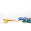 Brightly coloured sunglasses in orange, blue, and green, featuring a logo on one pair.
