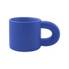 A blue ceramic coffee mug with a unique handle design, featuring a smooth matte finish and a logo.