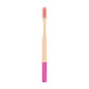 A large round handle bamboo toothbrush with a pink and natural bamboo design, featuring soft bristles.