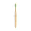 A large flat handle toothbrush with a bamboo body and green bristles. It features a simple design and a logo.