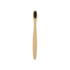 A small bamboo toothbrush with a natural wood handle and black bristles, featuring a simple design and a logo.
