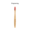 A small bamboo toothbrush with a pink bristle head and a wooden handle featuring a logo engraving.